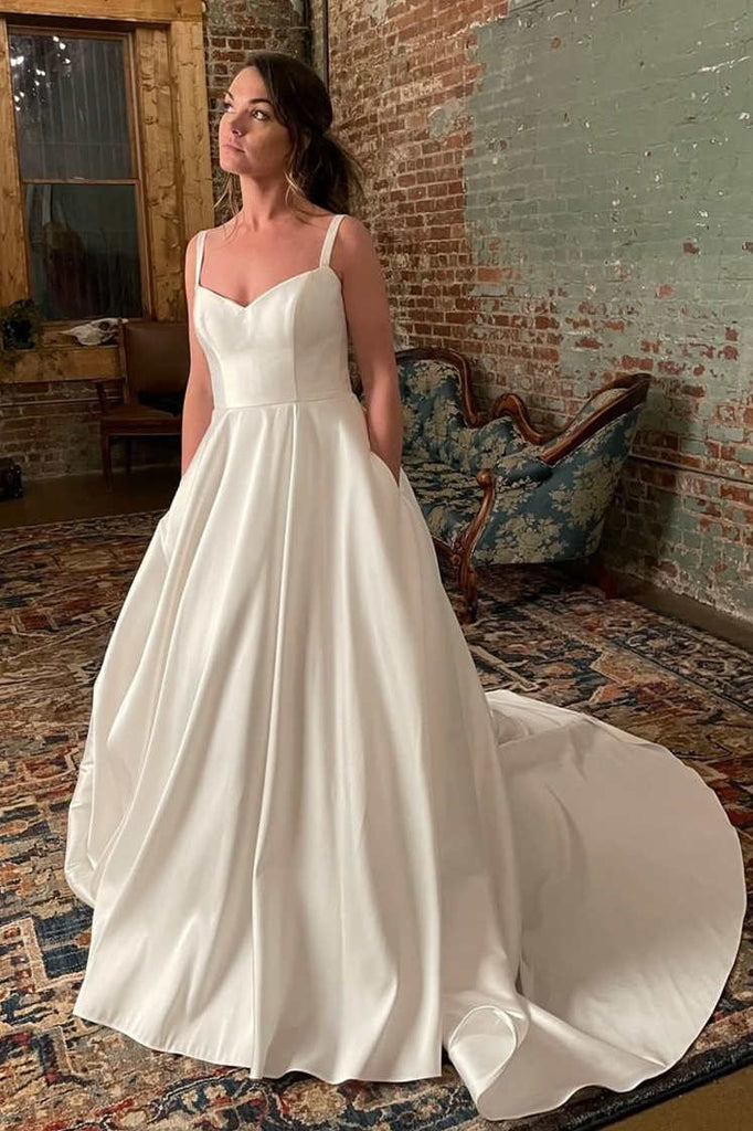 https://www.pgmdress.com/cdn/shop/files/SimpleWideStrapsIvoryWeddingGownwithPocketsWD633-1_1024x1024.jpg?v=1684595323